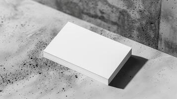 Blank mockup of a business card featuring a unique die shape for a memorable impression. photo