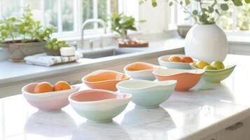 A set of ceramic fruit bowls in a gradient of pastel colors bringing a touch of whimsy to any kitchen counter. photo