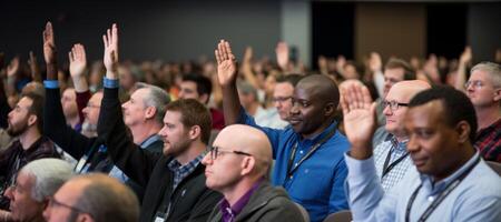 AI generated people at the conference raise their hands and vote Generative AI photo