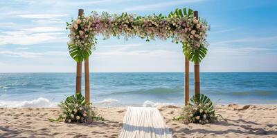 festive wedding arch on the seashore beach photo