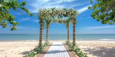 festive wedding arch on the seashore beach photo