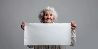 elderly woman holding a white banner in her hands photo