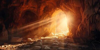 stone rocky empty cave tomb and light rays easter photo