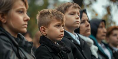 a child is sad at a funeral photo