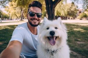 Selfie of a man with a dog in the park photo