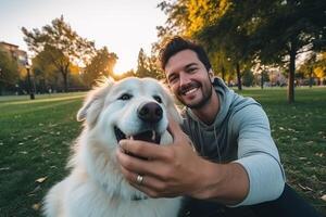 Selfie of a man with a dog in the park photo