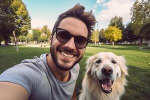 Selfie of a man with a dog in the park photo