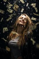 young girl under the rain of money photo