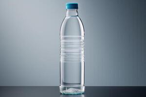 clean drinking water in a bottle against the background of a lake and mountains photo