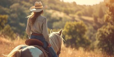 Cowgirl in a hat on a horse photo