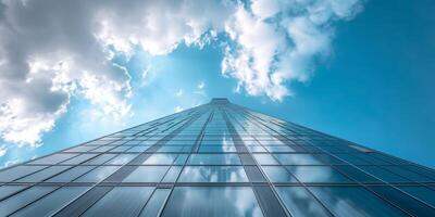 skyscraper reaching into the sky and breaking clouds photo