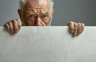 elderly woman holding a white banner in her hands photo