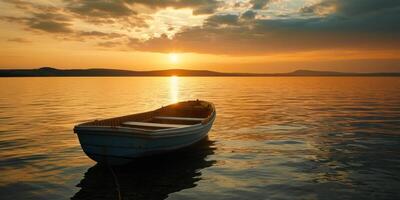 empty boat on the lake at sunset photo