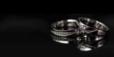 wedding rings on a black background photo