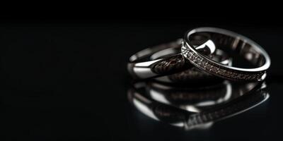 wedding rings on a black background photo