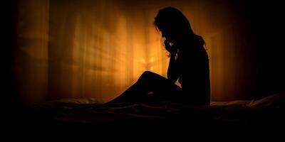 depressed girl silhouette against window background photo