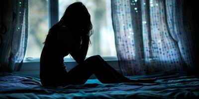 depressed girl silhouette against window background photo