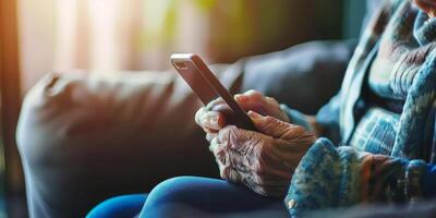 elderly woman looking at smartphone photo