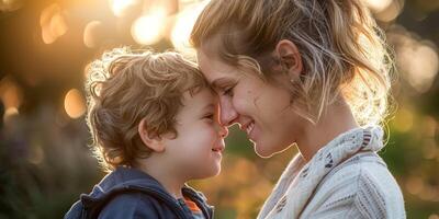 young mother touches nose with her little child photo