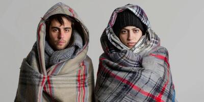 the couple was cold and dressed warmly at home photo