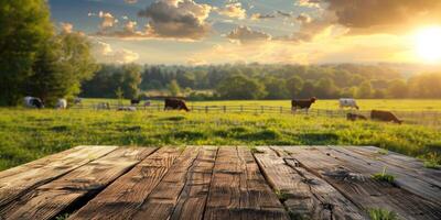 wooden table against the background of cows in the pasture photo