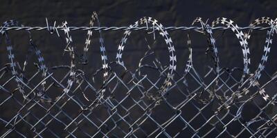 barbed wire fence in prisons photo