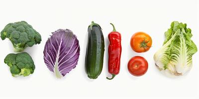 Assorted fruits and vegetables on a white background photo