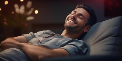 a man falls asleep on the sofa with a smile photo