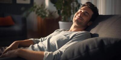 a man falls asleep on the sofa with a smile photo