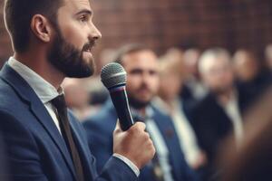 man with microphone at public speaking photo