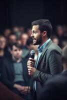 man with microphone at public speaking photo