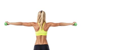 athletic girl in sports underwear with dumbbells in her hands on a white background, rear view banner photo