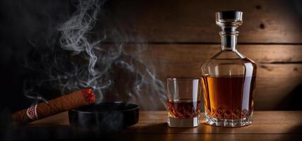 A glass of whiskey with a smoking cigar and an ashtray on a wooden background photo