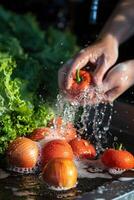 hands wash vegetables splashing water photo