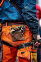 Maintenance worker with a bag and a set of tools on his belt photo