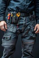 Maintenance worker with a bag and a set of tools on his belt photo