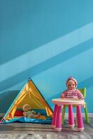children's room with toys and tent photo
