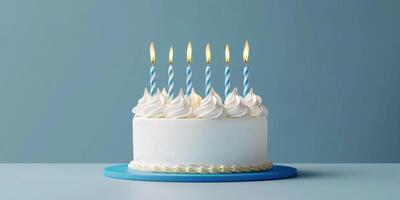 birthday cake with candles on a plain background photo