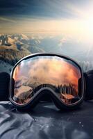 Ski goggles with mountains reflection photo