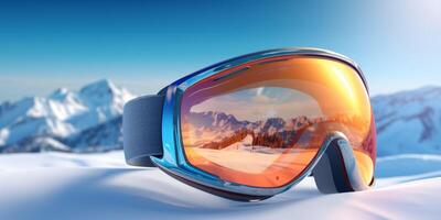 Ski goggles with mountains reflection photo