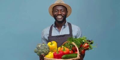 Farmer holding vegetables and fruits in his hands photo