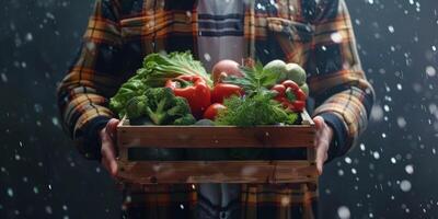 Farmer holding vegetables and fruits in his hands photo