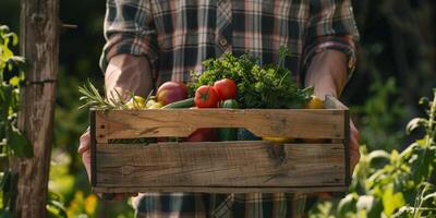 Farmer holding vegetables and fruits in his hands photo