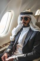 Arab businessman in a business jet photo