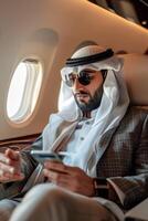 Arab businessman in a business jet photo