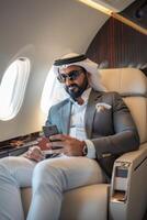 Arab businessman in a business jet photo