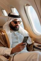 Arab businessman in a business jet photo