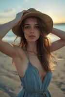 girl in a hat on the seashore photo
