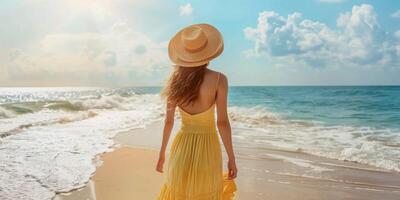 girl in a hat on the seashore photo