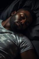 man sleeping peacefully in bed photo